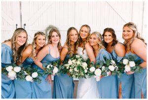 bride and groom enjoy their wedding with family and friends at a Charlotte, NC rustic wedding venue