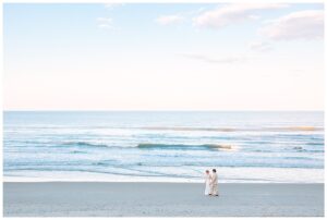 Couple stands together to pose for their couples portraits at a unique wedding venue in North Carolina