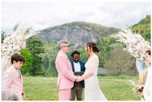 Couple stands together to pose for their couples portraits at a unique wedding venue in North Carolina