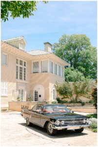 Classic car parked in front of Separk Mansion.