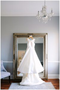 Bridal gown hanging on a mirror at Separk Mansion.