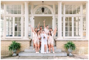 Bridesmaids celebrating with champagne at Separk Mansion.