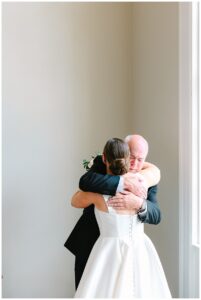 Emotional father-daughter hug before the wedding.