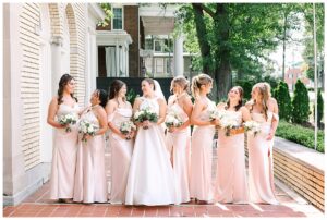 Bride and bridesmaids posing together at Separk Mansion.