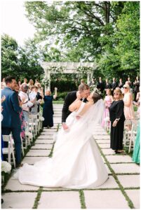 Wedding couple kissing at Separk Mansion ceremony.