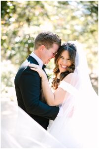 A joyful bride and groom embrace during their wedding at Vanlandingham Estate, Charlotte, NC.