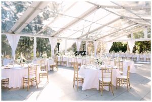 Elegant wedding reception setup under a clear tent at Vanlandingham Estate, Charlotte, NC.