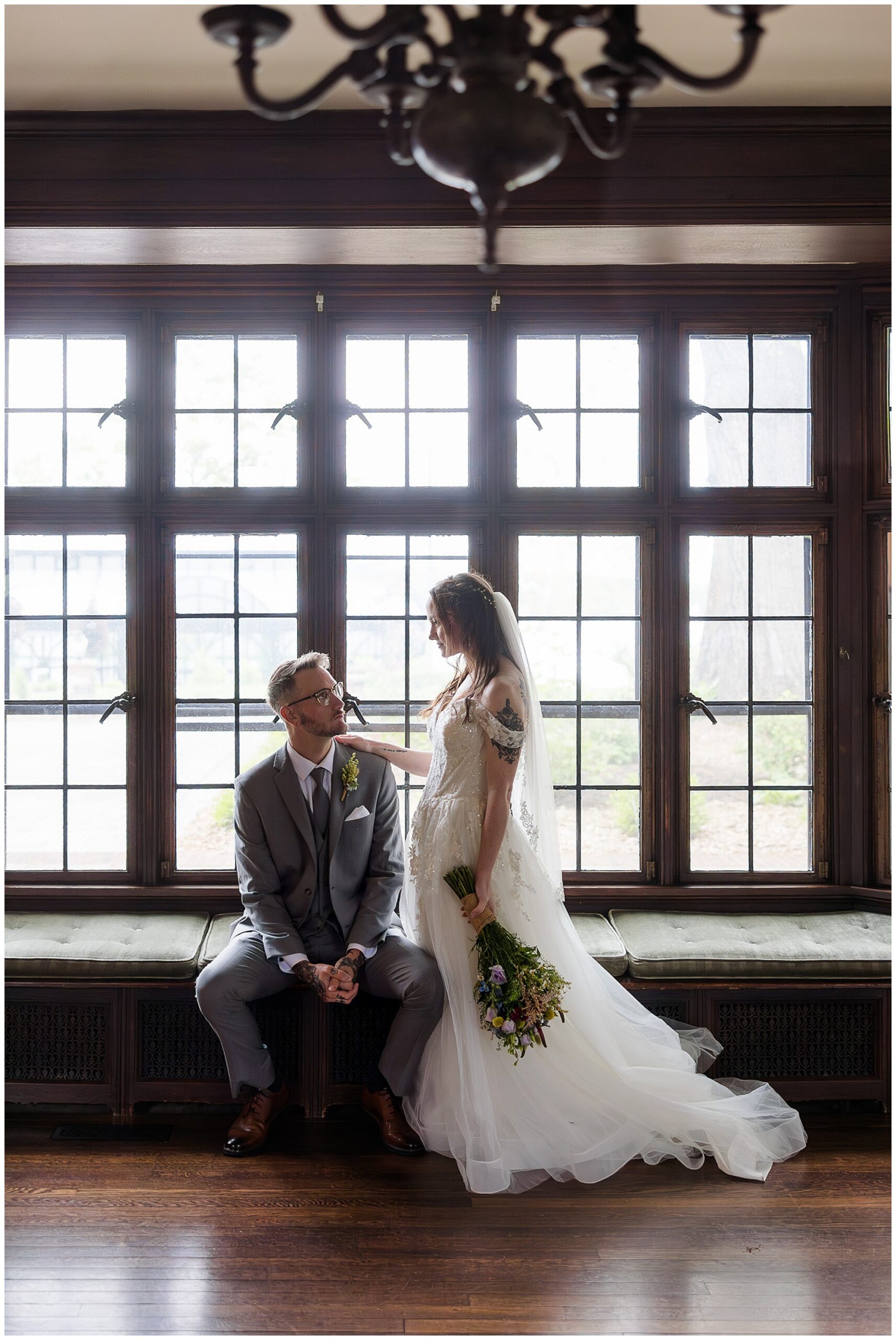 bride and groom portrait inside Tudor House window seat New Franklin Ohio wedding photographer
