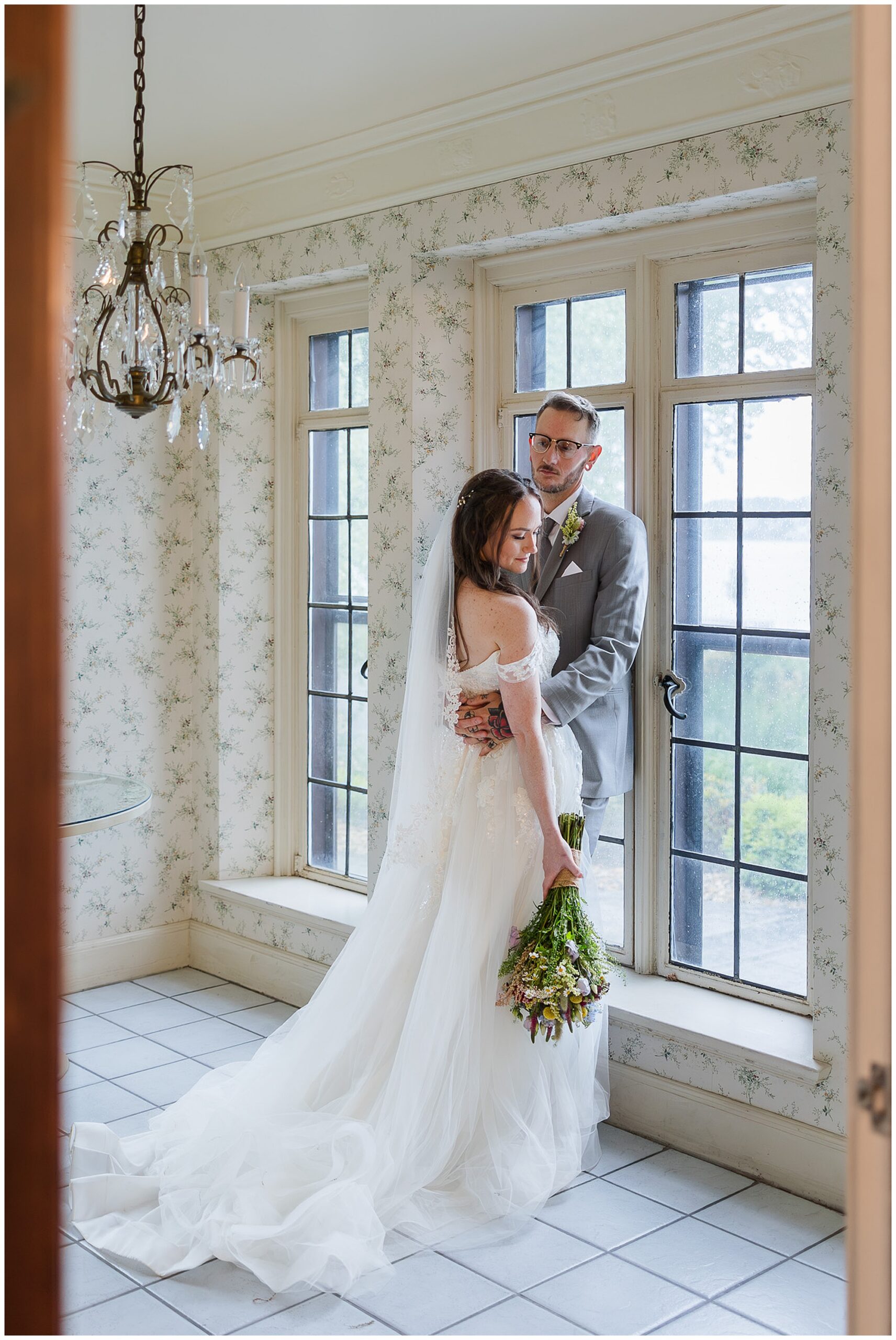 groom admiring bride Tudor House interior portrait Mason's Cove Ohio wedding photography