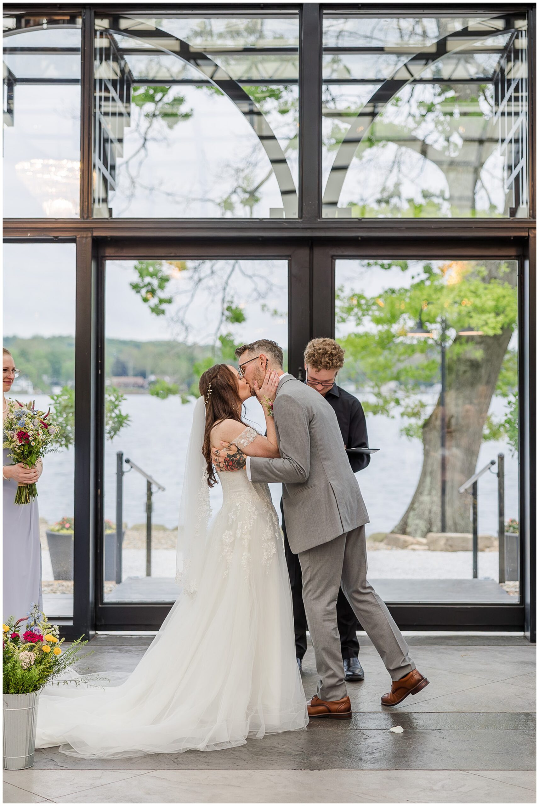 bride and groom first kiss ceremony Tudor House Mason's Cove New Franklin Ohio wedding