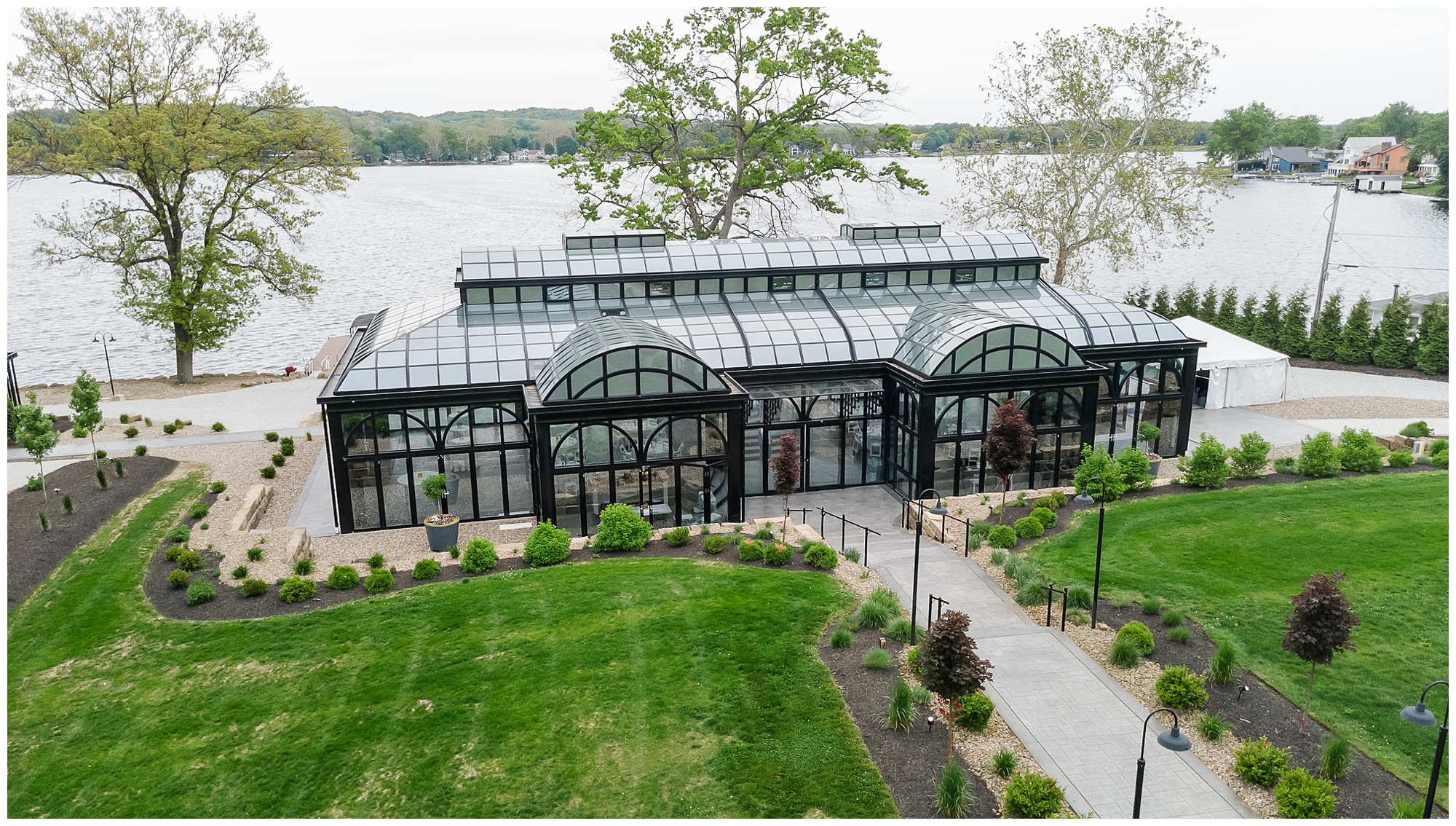 Tudor House at Mason's Cove glass conservatory aerial drone shot Turkey Lake New Franklin Ohio